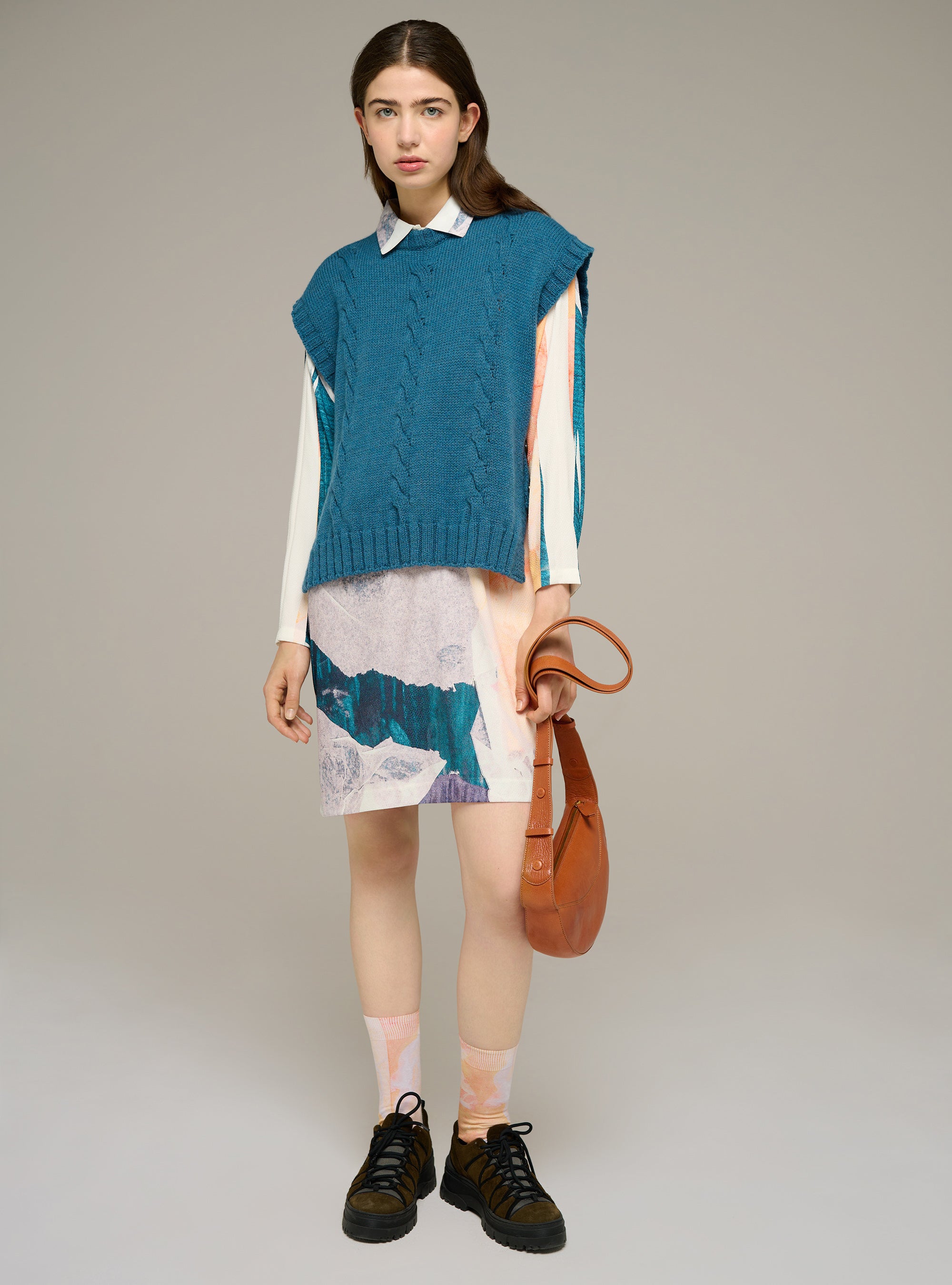 Sleeveless cable-knit sweater