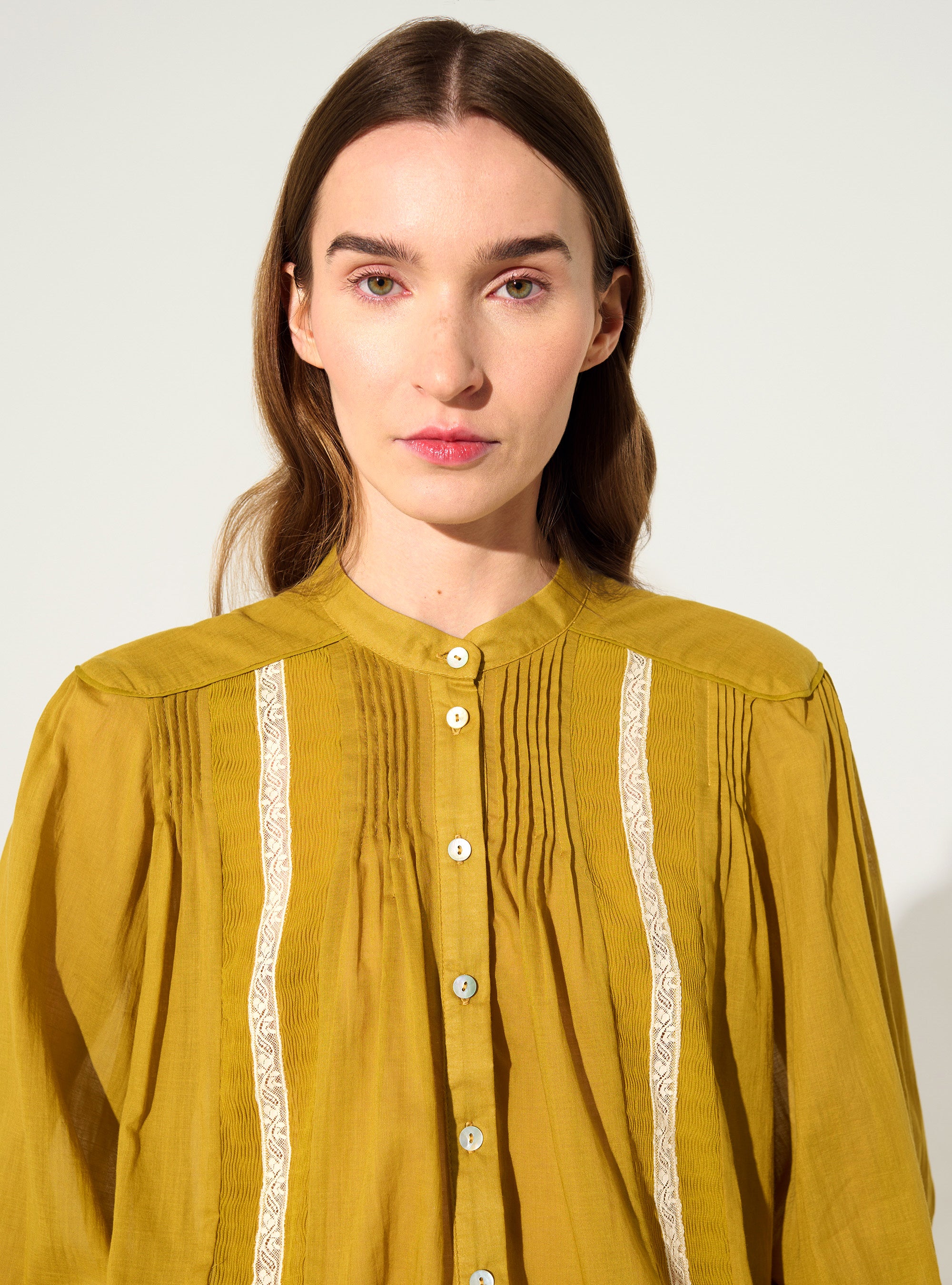 Oversized pleated shirt and Calais-Caudry® lace yellow ochre