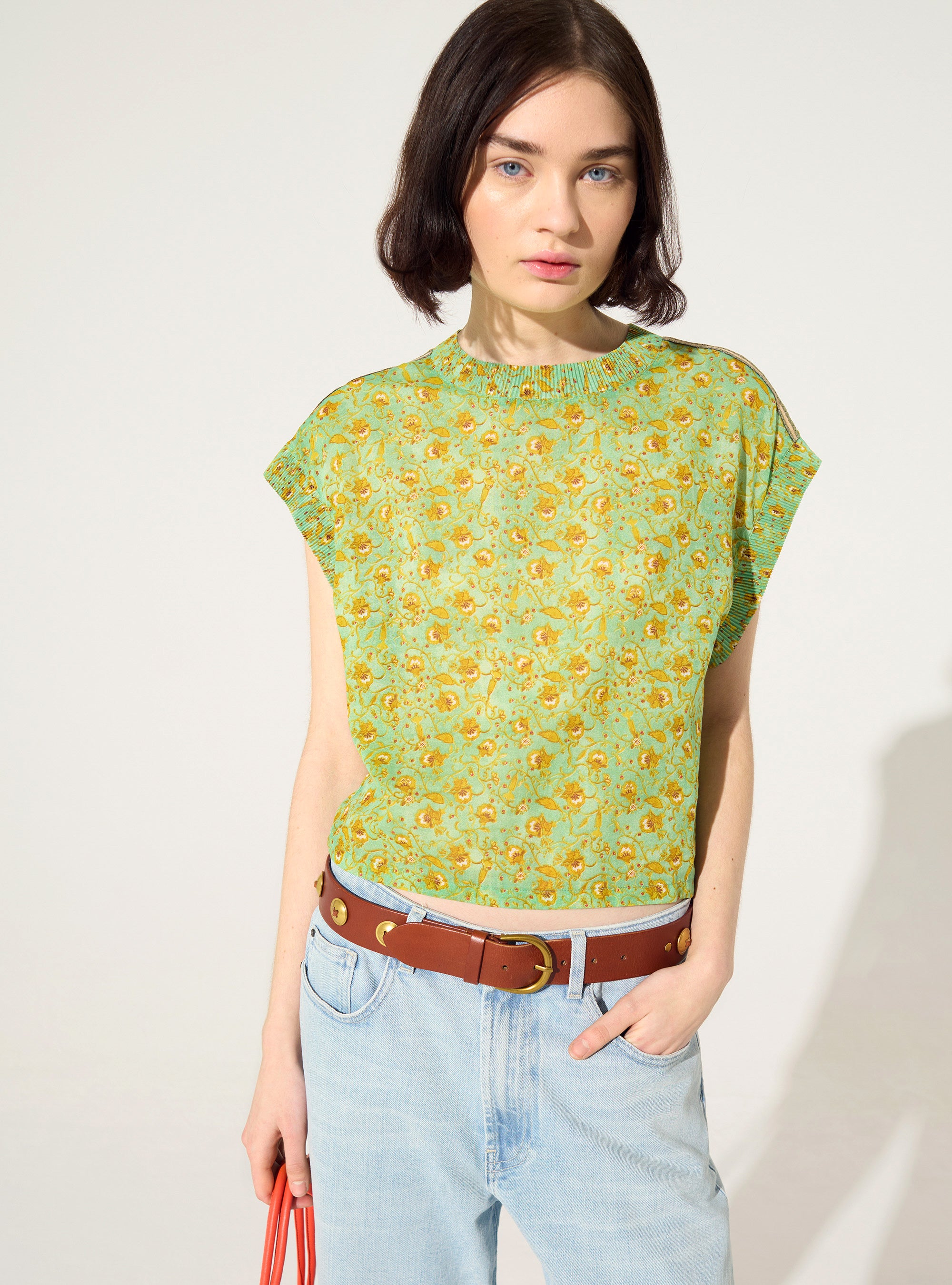 Fitted pleated blouse printed in green cotton