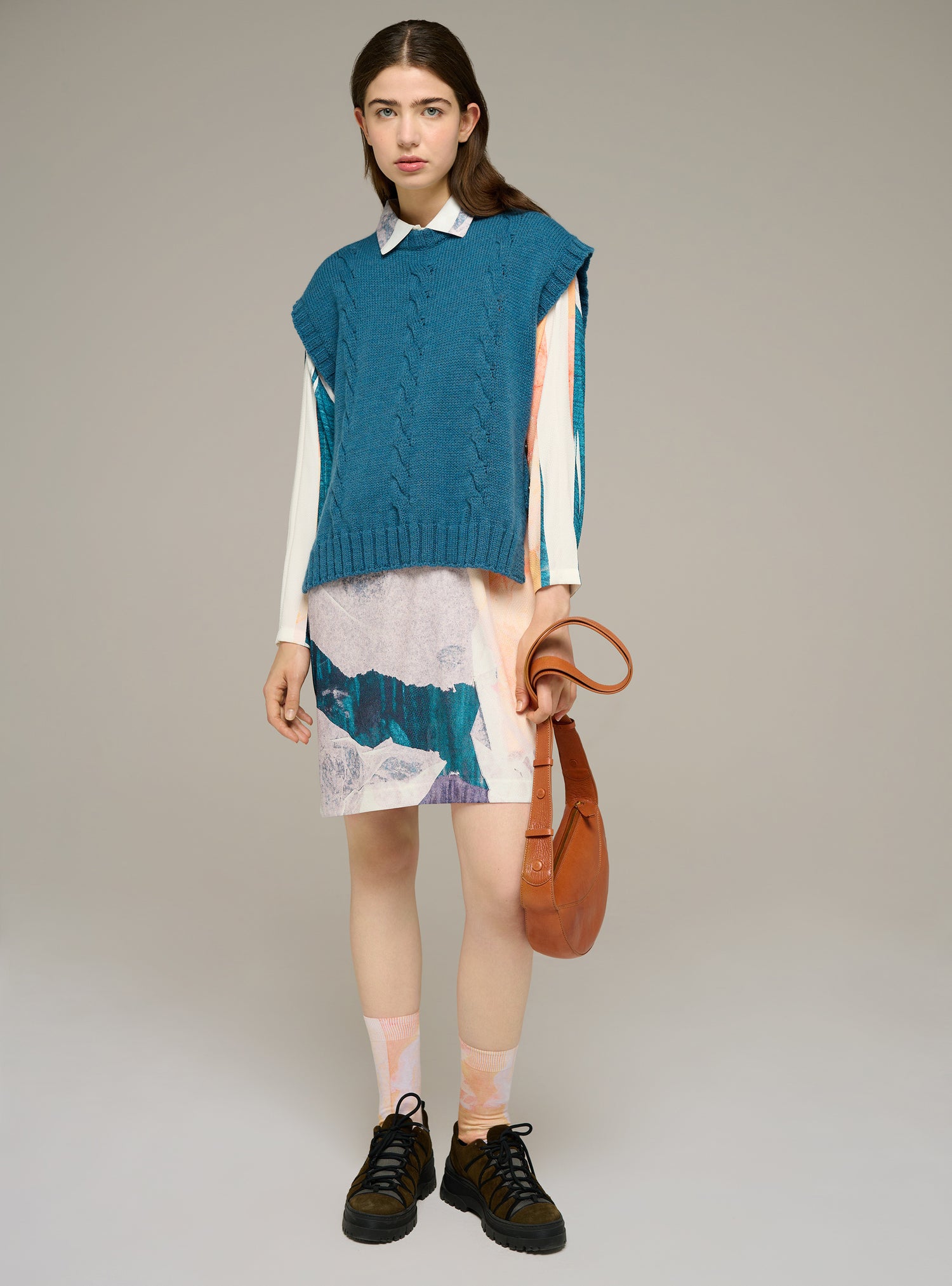 Sleeveless cable-knit sweater