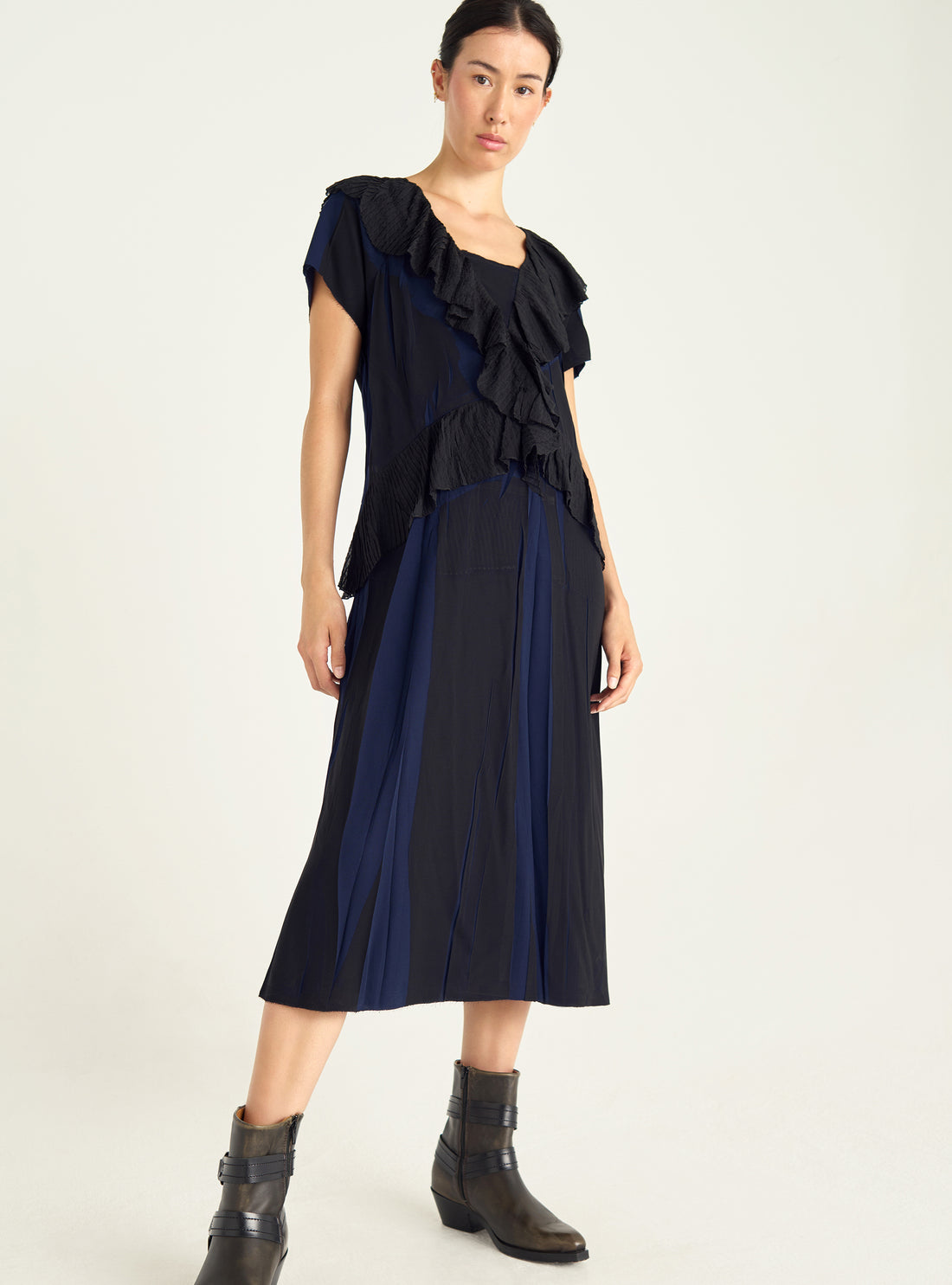 Dress with pleated ruffles and flowing material