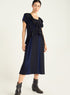 Dress with pleated ruffles and flowing material