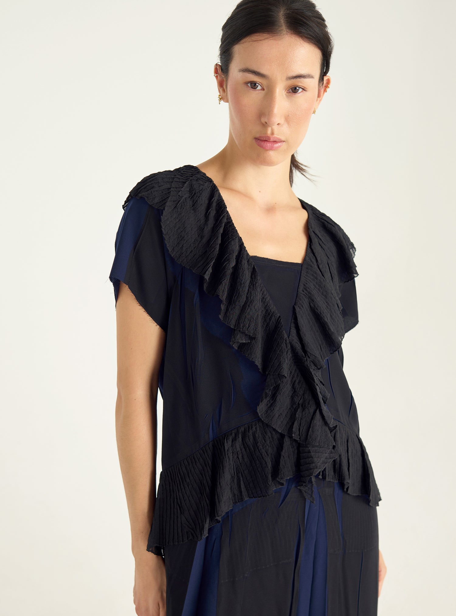 Dress with pleated ruffles and flowing material
