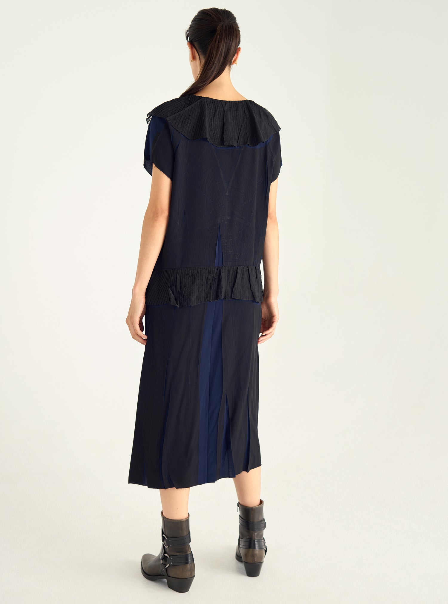 Dress with pleated ruffles and flowing material