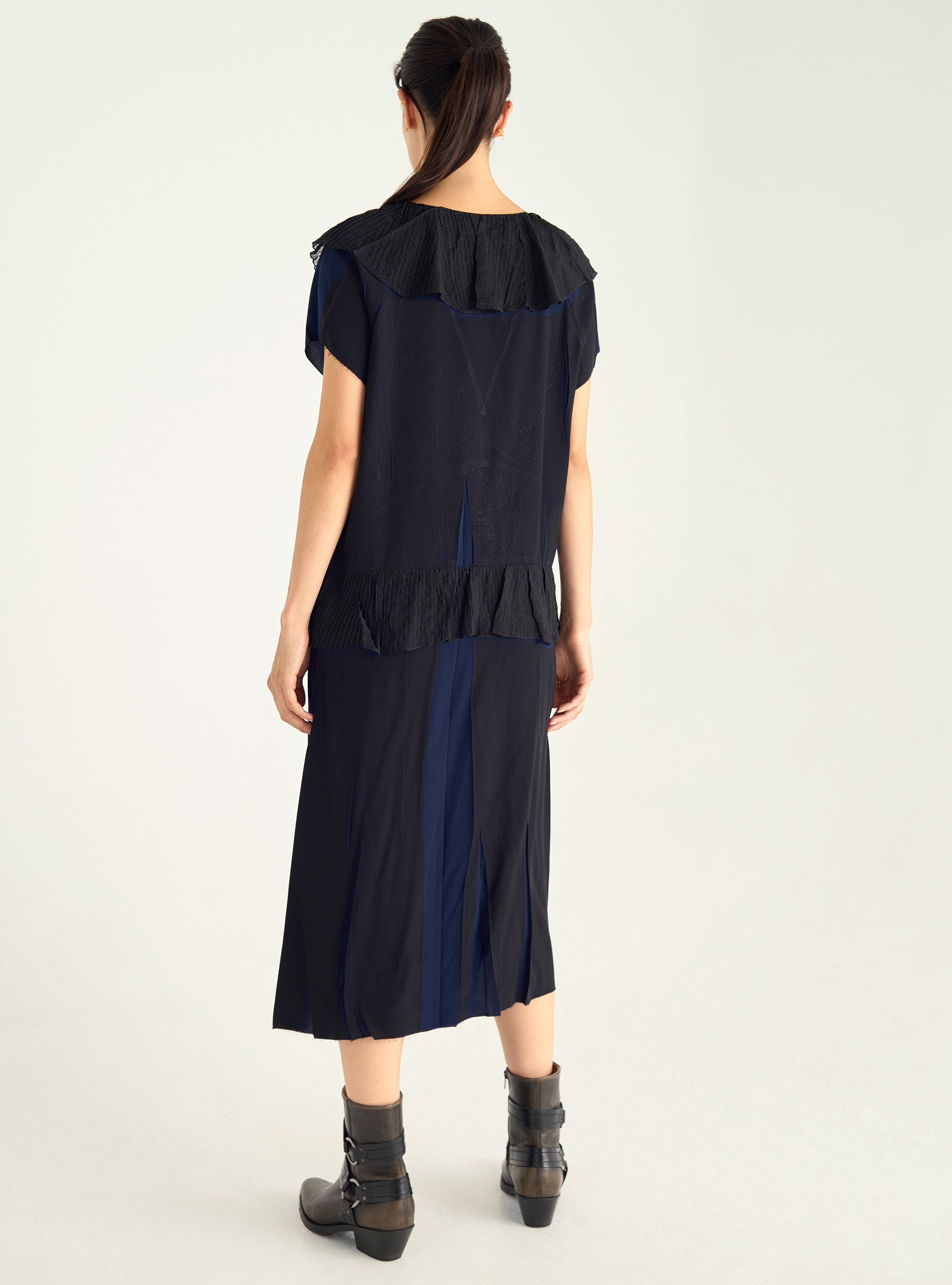 Dress with pleated ruffles and flowing material