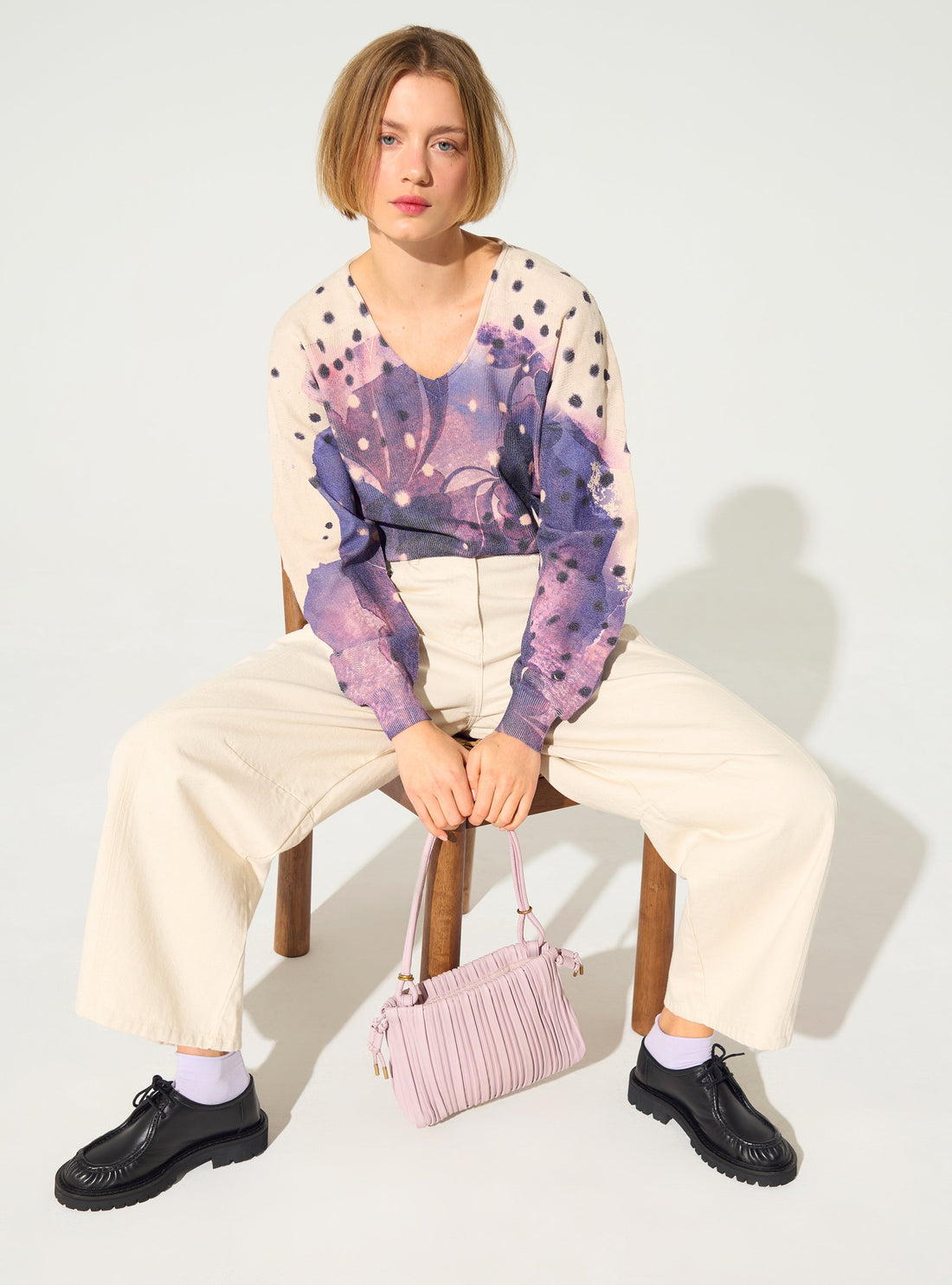 Pleated and sublimated purple v-neck sweater