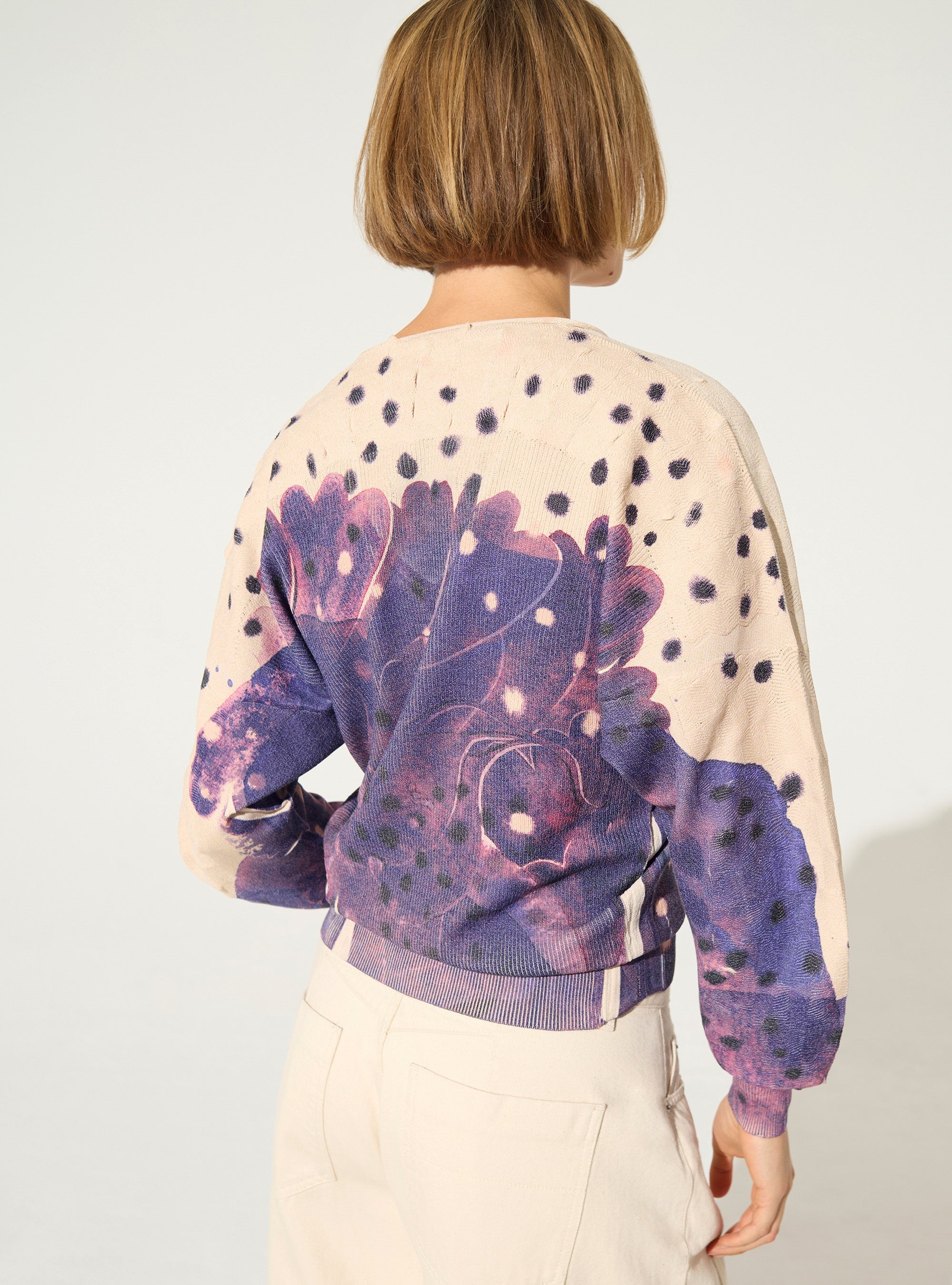 Pleated and sublimated purple v-neck sweater