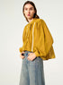 Oversized pleated shirt and Calais-Caudry® lace yellow ochre