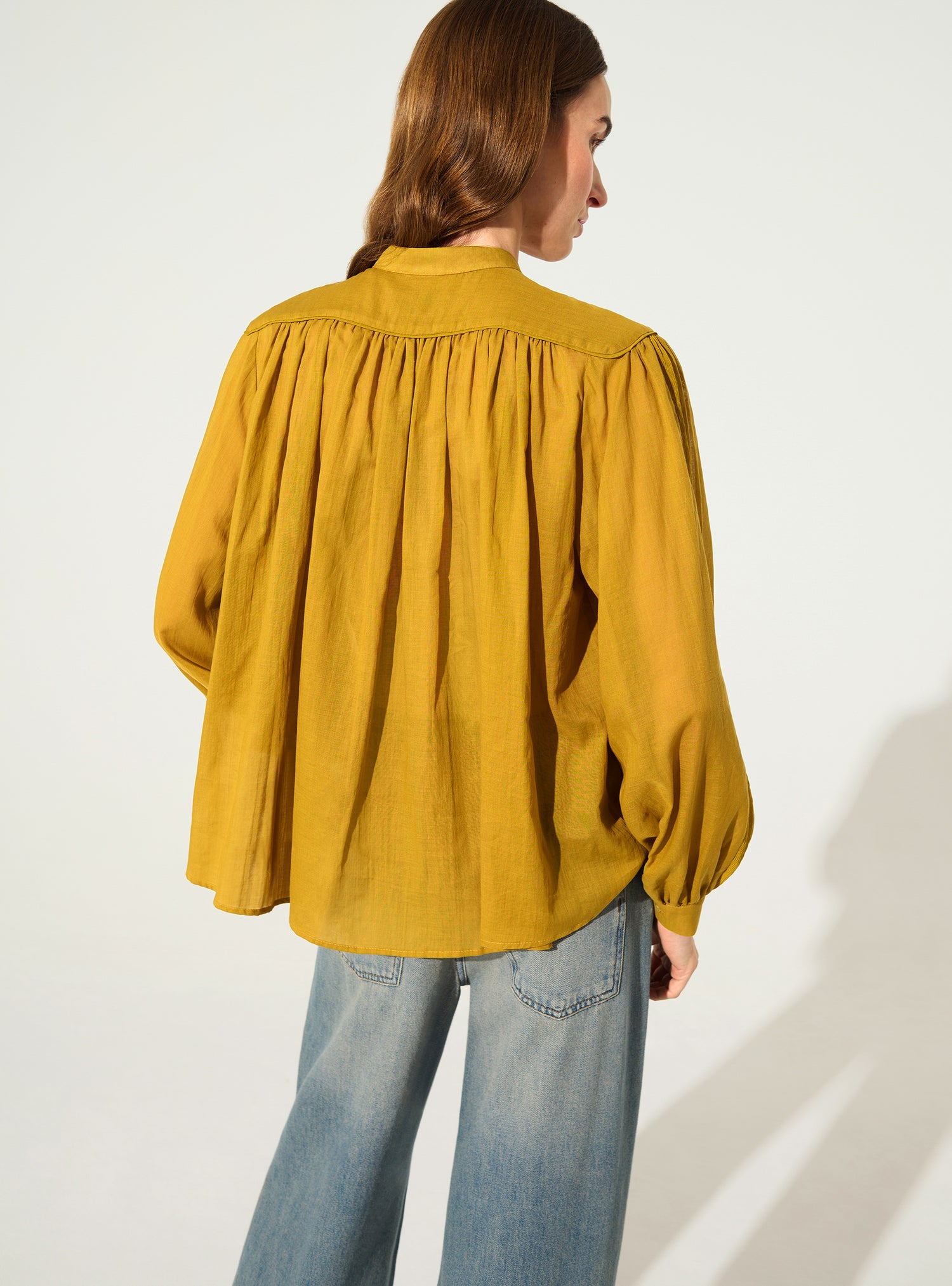 Oversized pleated shirt and Calais-Caudry® lace yellow ochre
