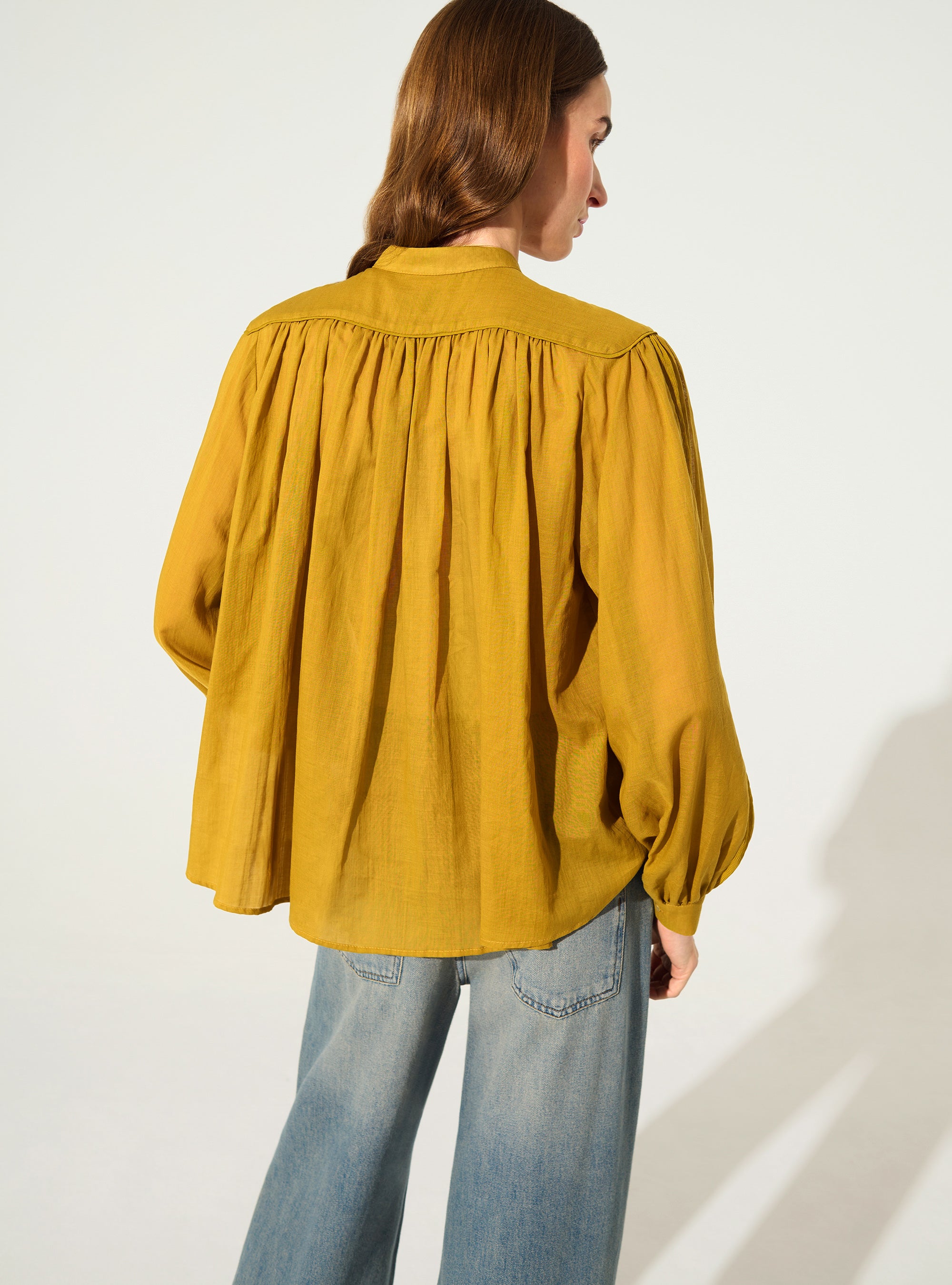 Oversized pleated shirt and Calais-Caudry® lace yellow ochre