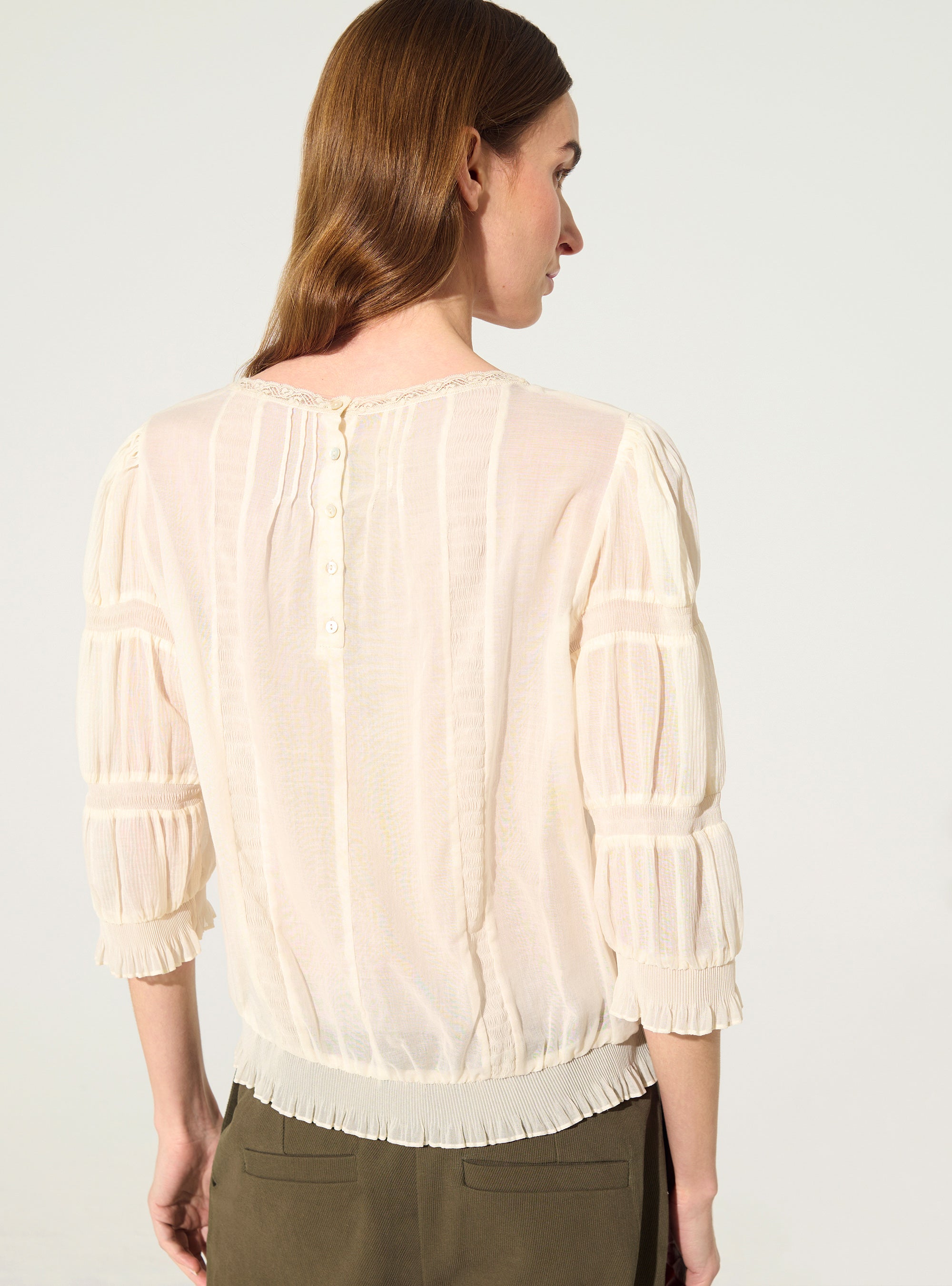 Pleated blouse and ecru Calais-Caudry® lace
