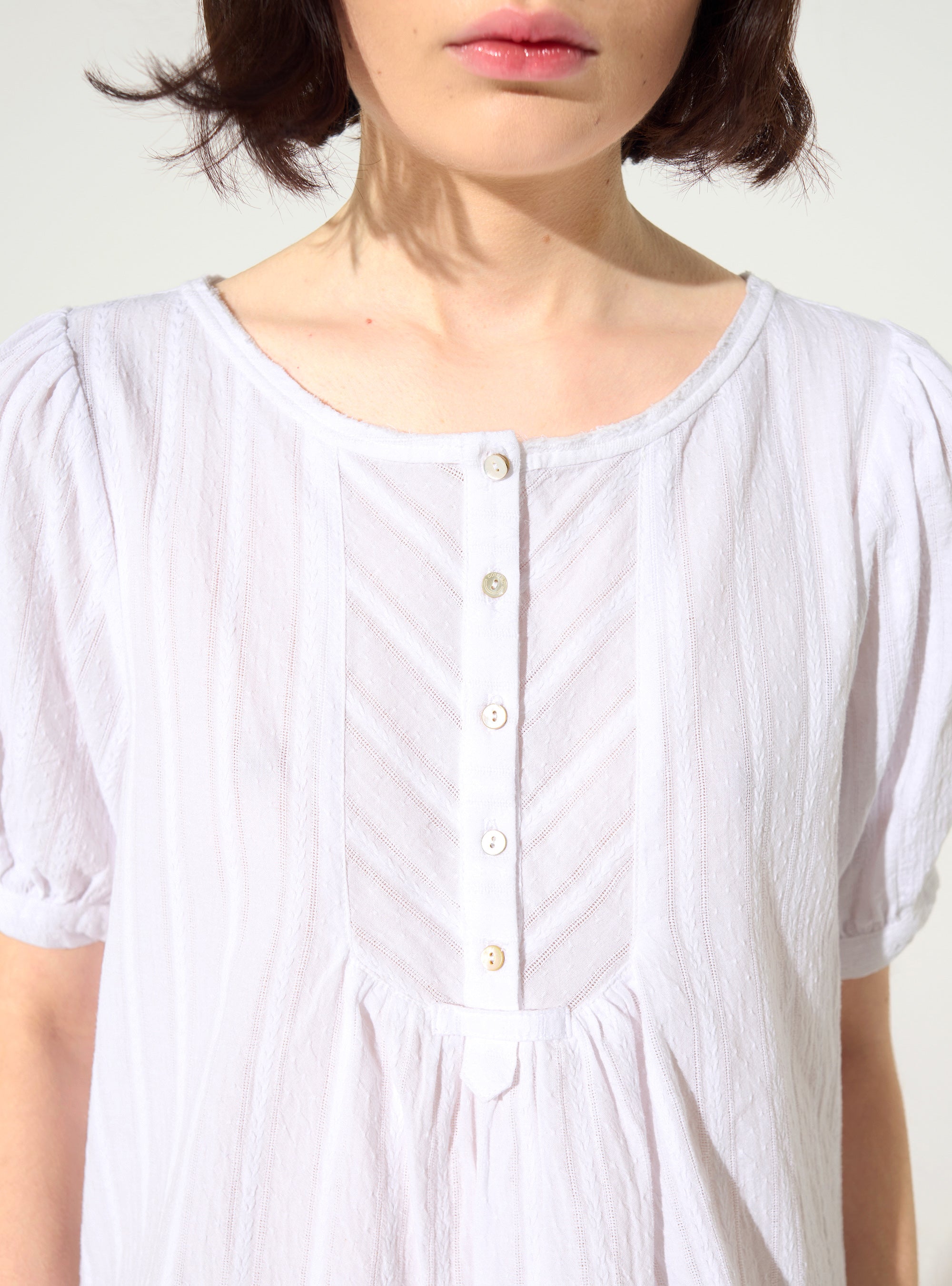 Loose white cotton blouse