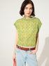 Fitted pleated blouse printed in green cotton