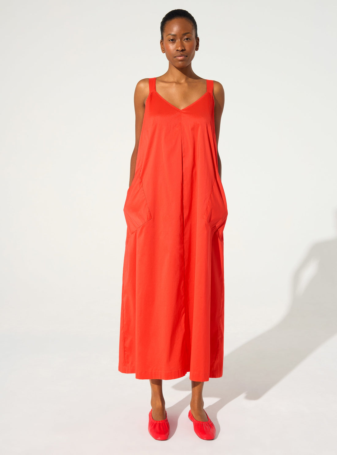 Long pleated dress in red cotton